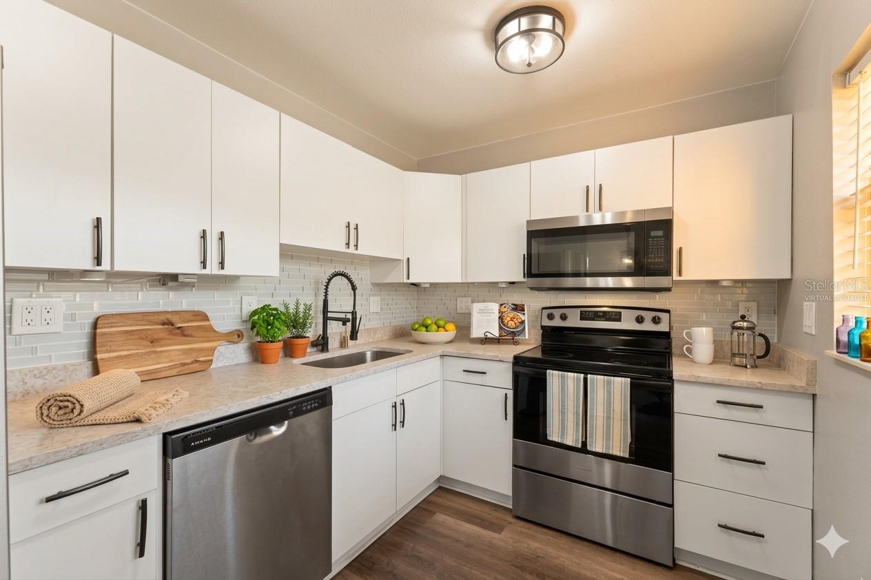 Kitchen / Image virtually staged.