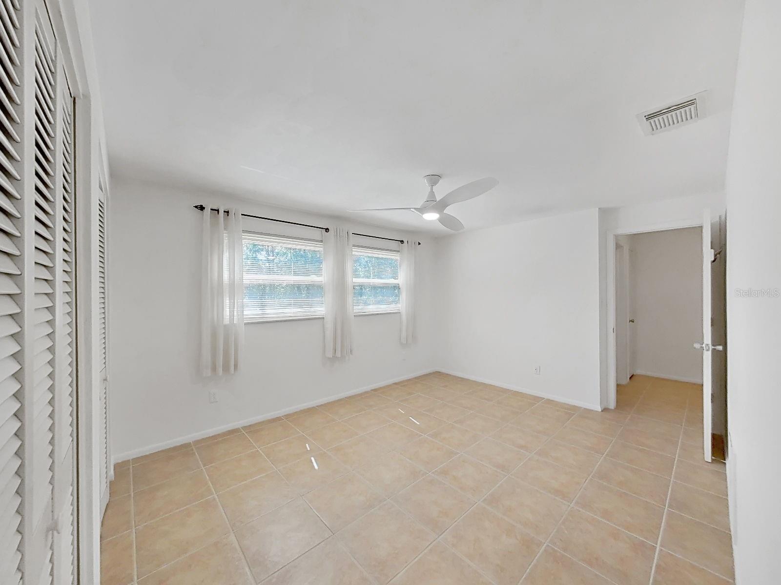 Bedroom 2- Large and spacious in it's own separate wing with bathroom and storage closets.