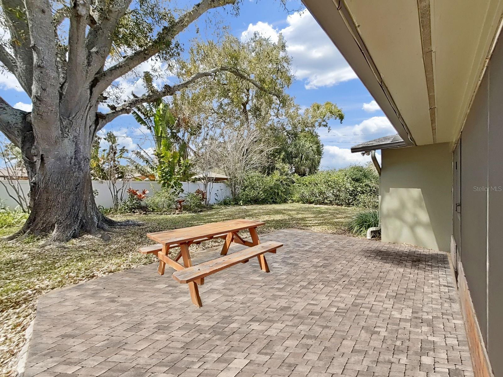 Charming brick paver patio offers the perfect spot for hosting barbecues & gatherings!
