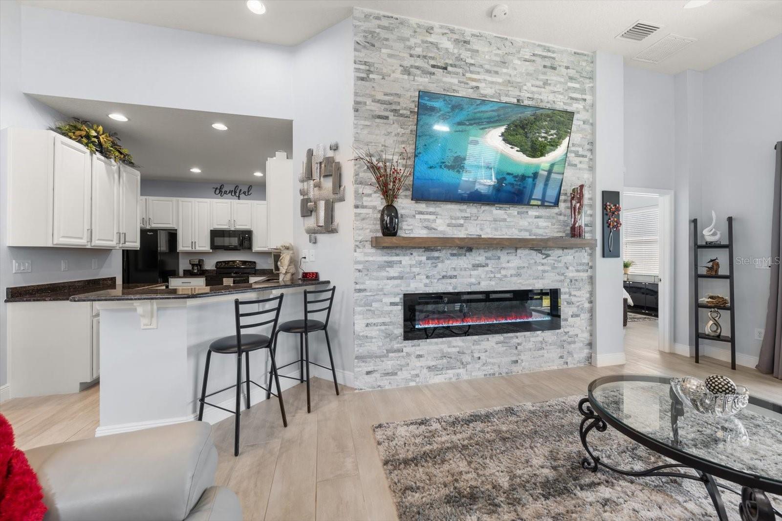 The fabulous stacked stone fireplace is a showstopper!