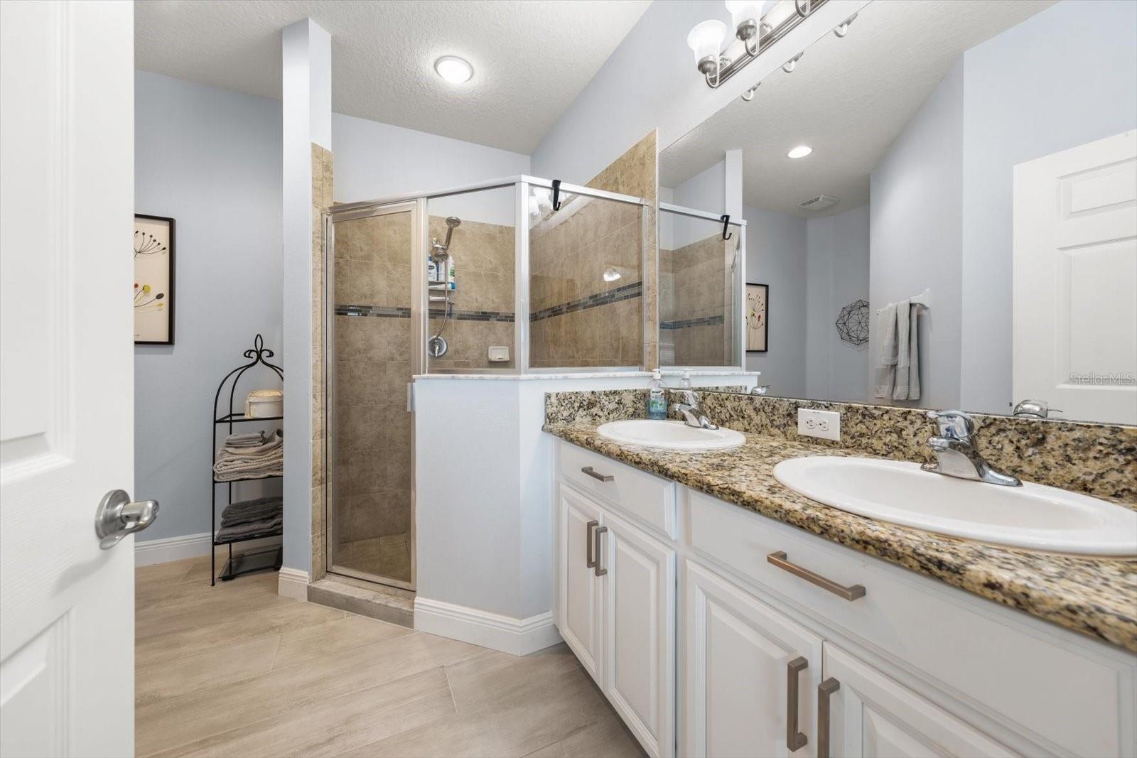 Owners bathroom with dual vanities