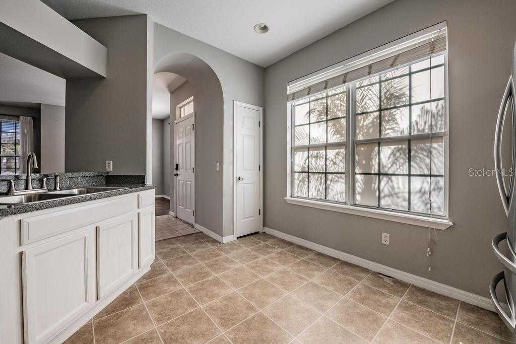 Kitchen, granite counter tops, tile flooring, lots of light.