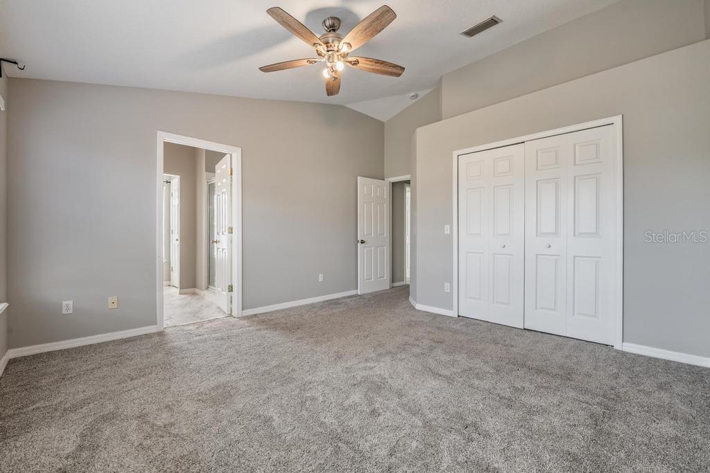 Master Bedroom with ceiling fan/light fixture.