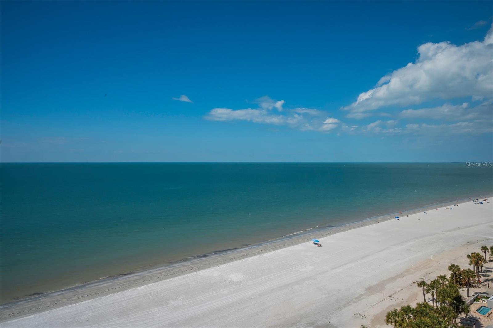 Wide, open-air balcony capturing boundless waterfront scenery