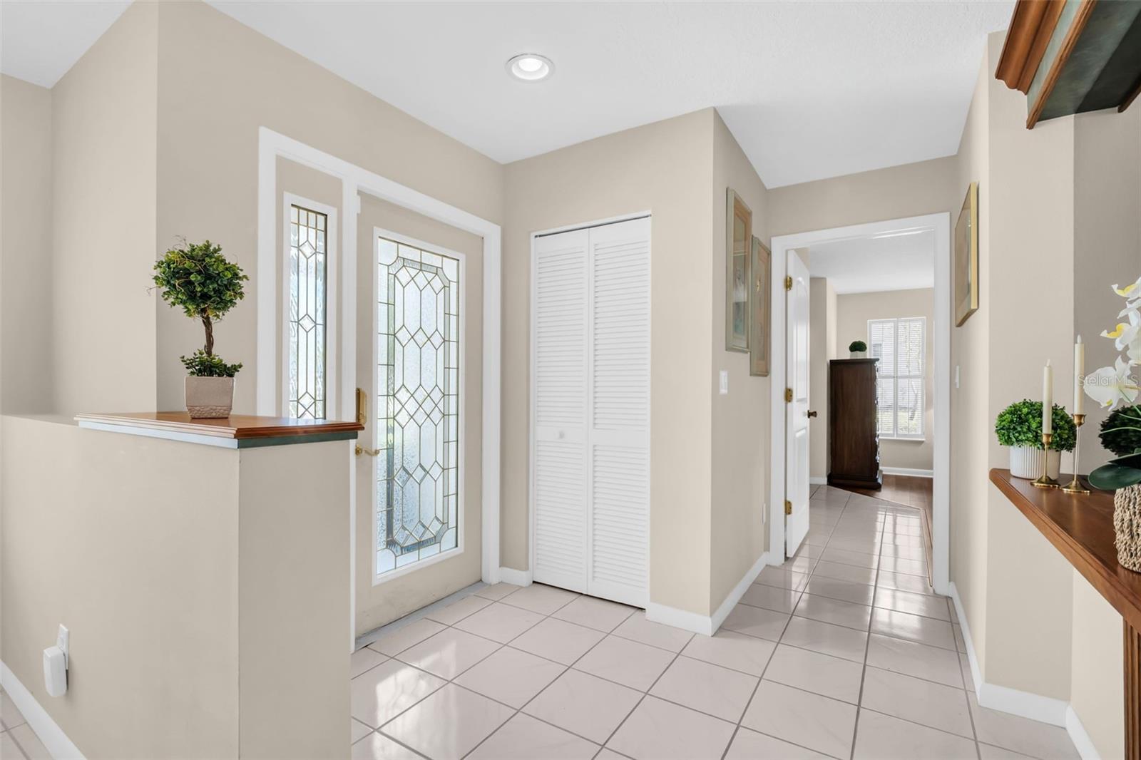 Elegant glass front door entry & gracious coat closet~