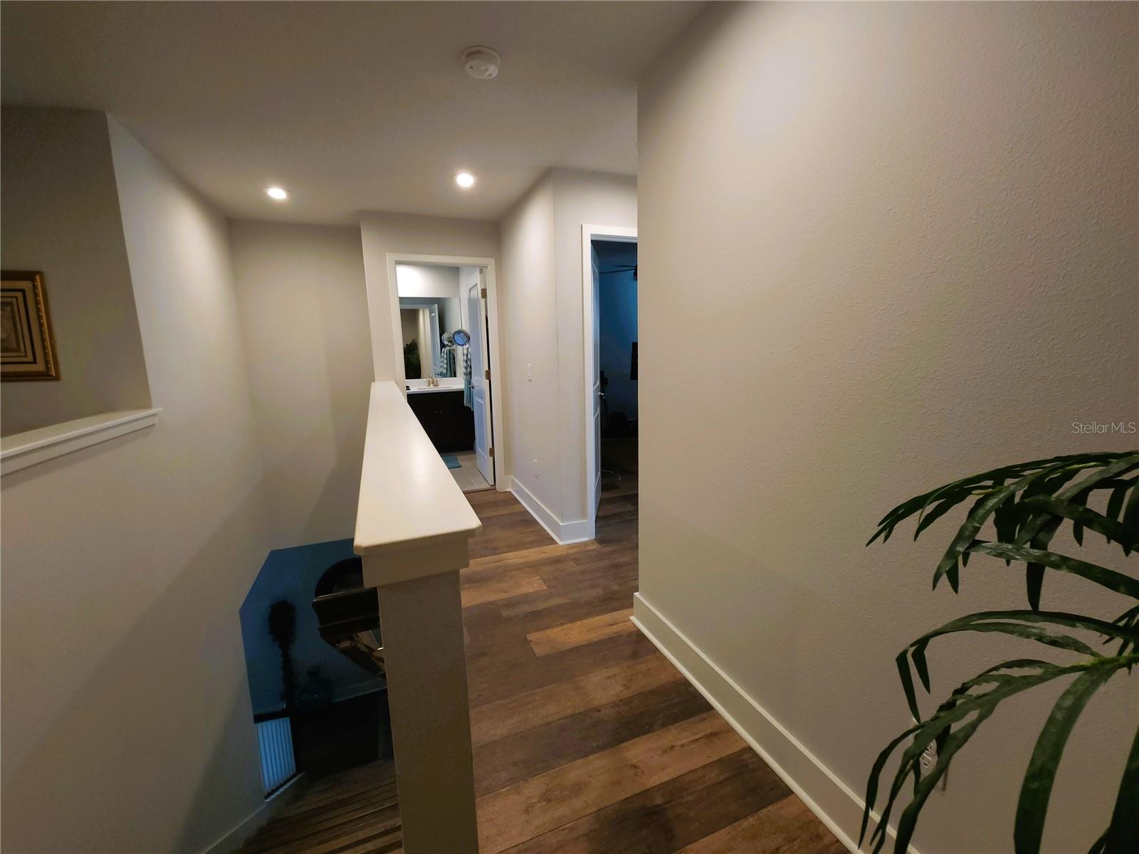 Hallway to secondary bedrooms and bath upstairs