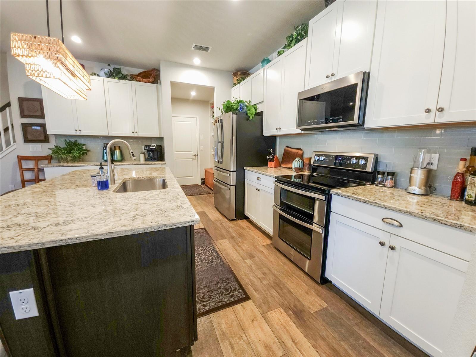Kitchen looking toward garage entry