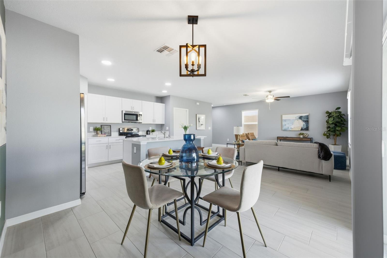 Dining room with view of living room and kitchen.