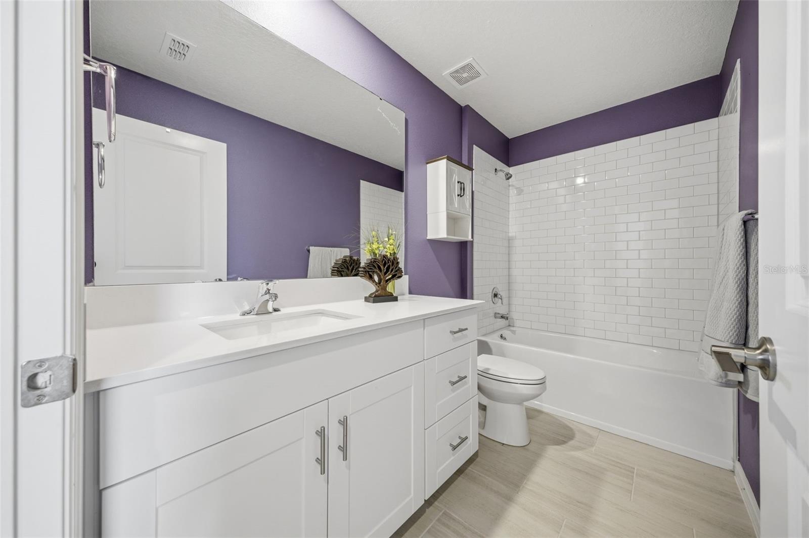 Second floor bathroom with tub and shower