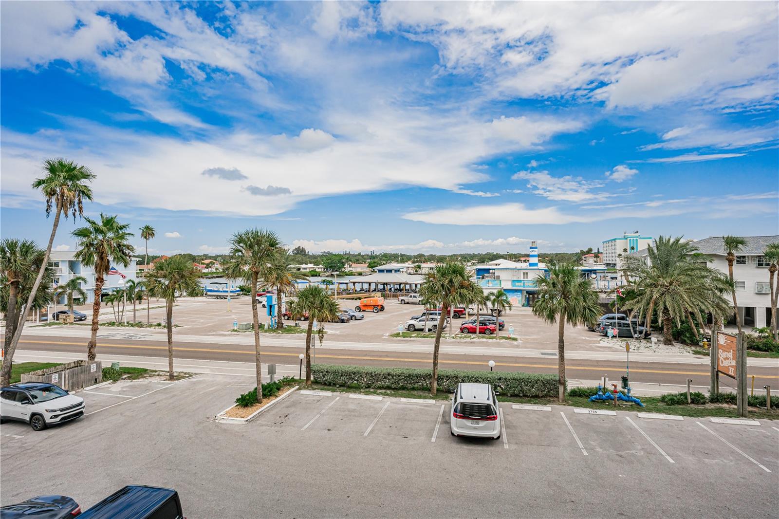 Parking lot with Caddy's Pub on the Intracoastal across Gulf Blvd