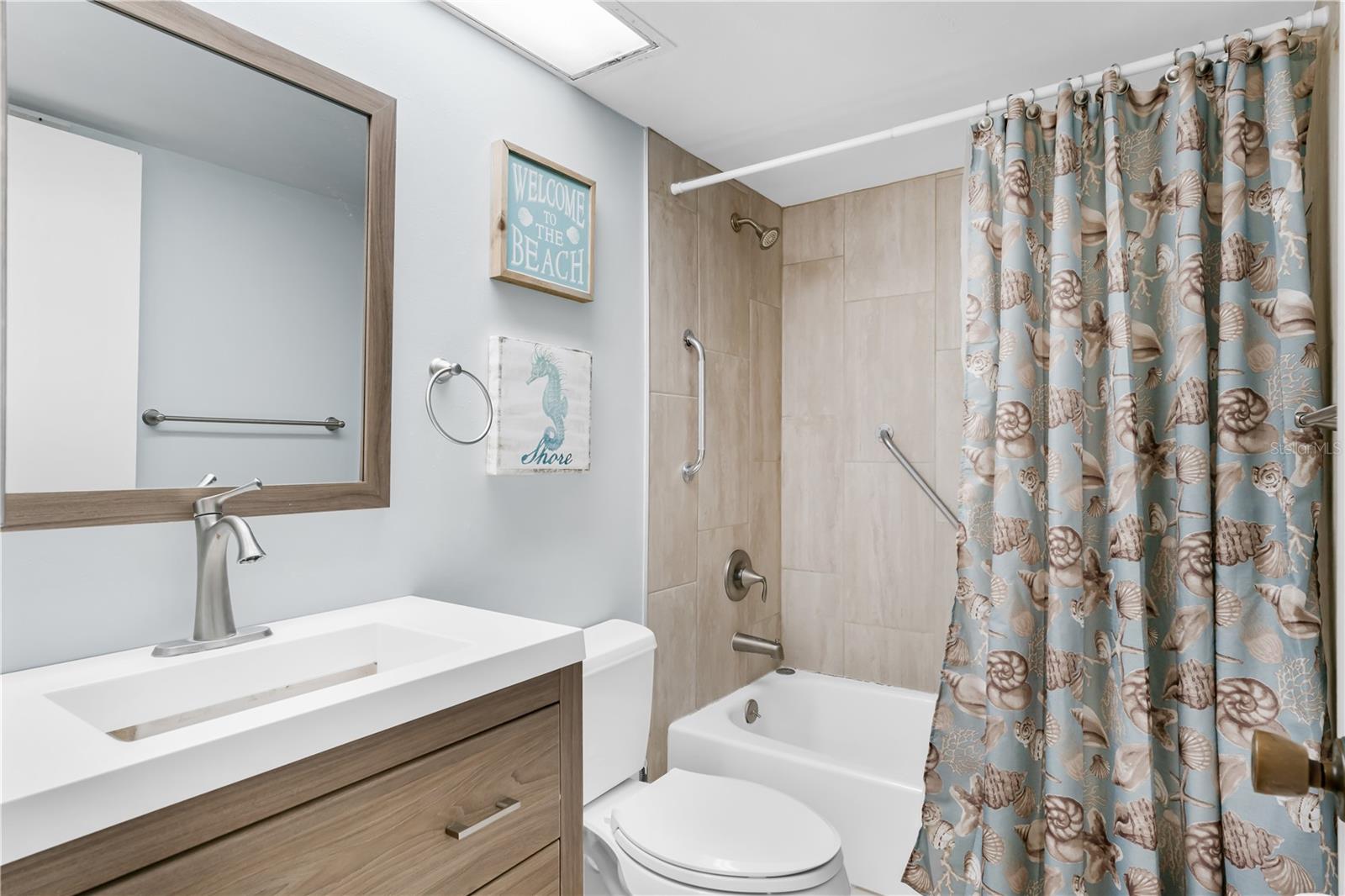 Bathroom 2 with stone vanity with tub/shower combo