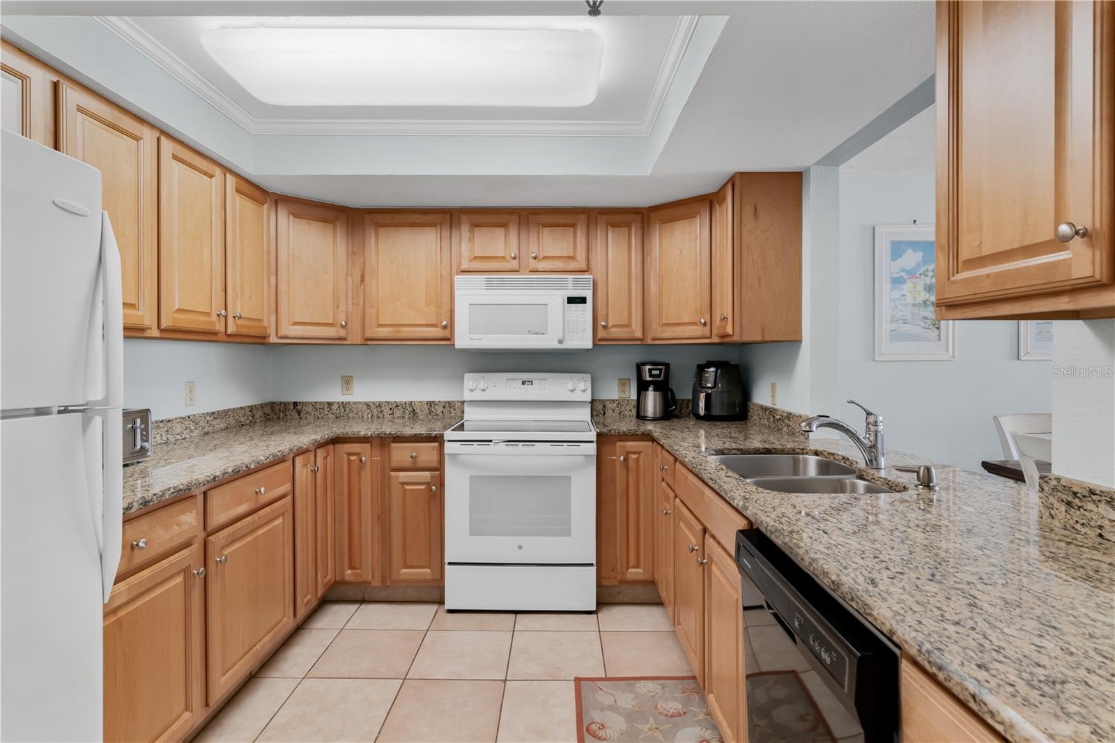 Kitchen with granite countertops and wood cabinets