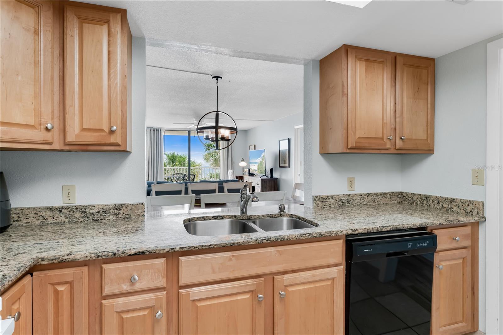 Kitchen with granite countertops and wood cabinets