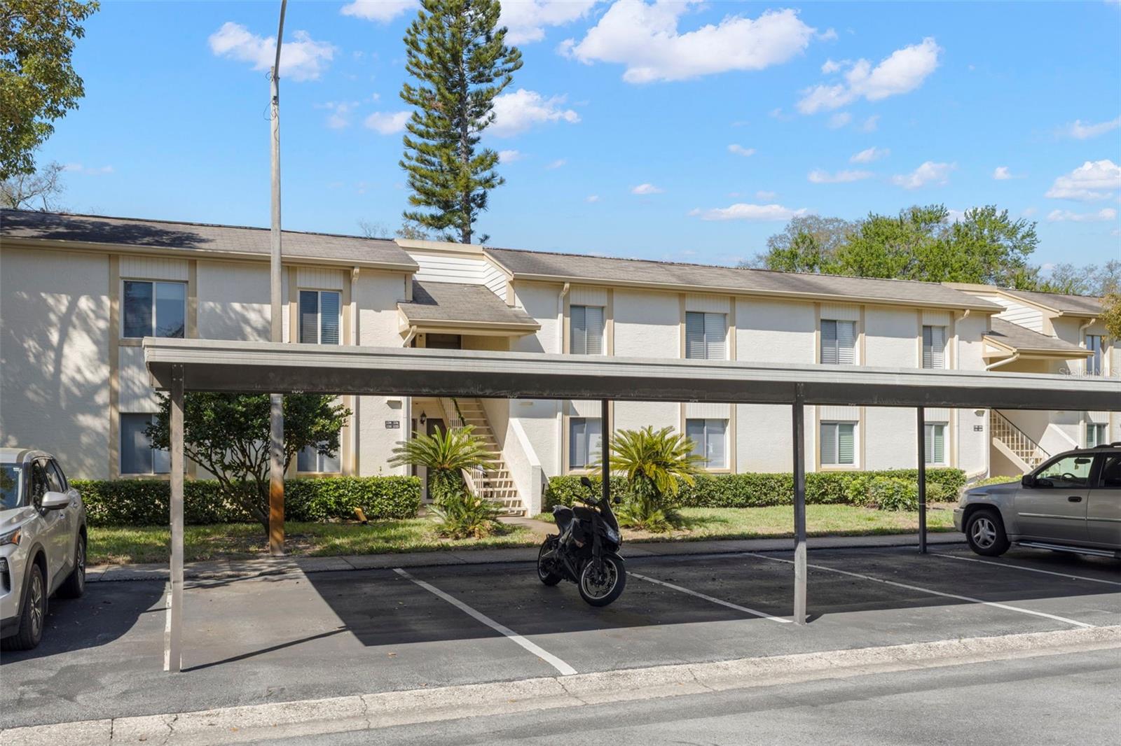 CARPORT AND ENTRANCE TO UNIT
