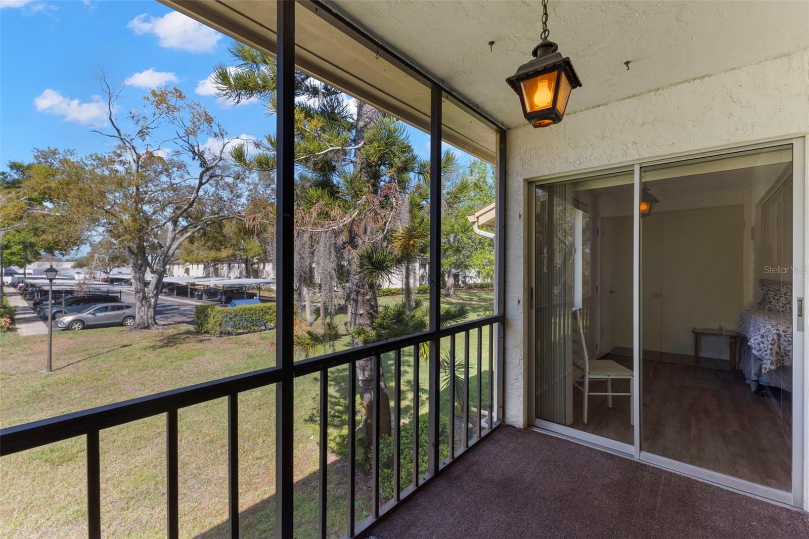 LANAI FACING PRIMARY SUITE - THERE ARE @ SETS OF SLIDERS - 1 TO LIVING AREA AND ONE TO PRIMARY SUITE