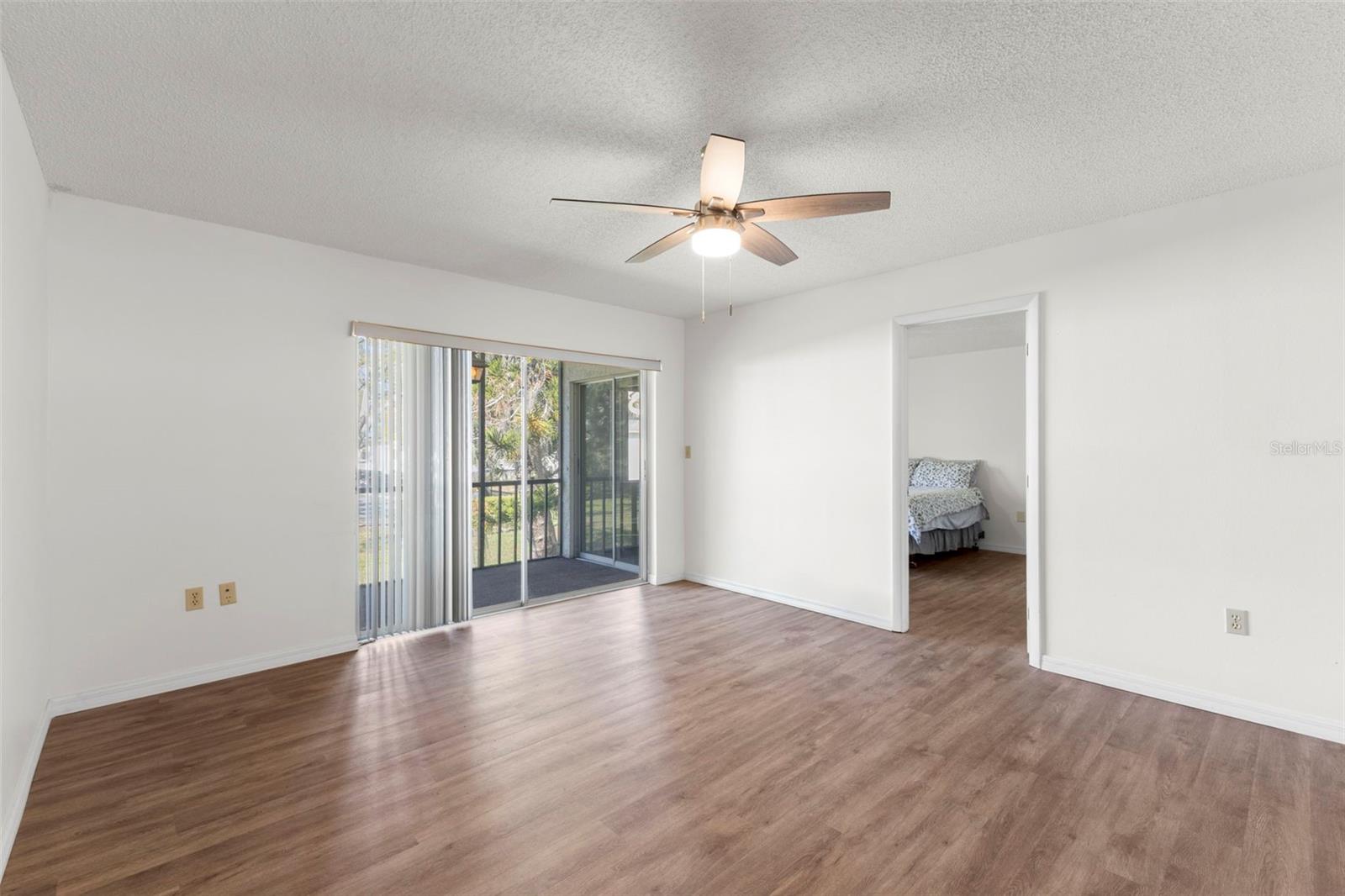 LIVING AREA / DOORWAY TO PRIMARY BEDROOM