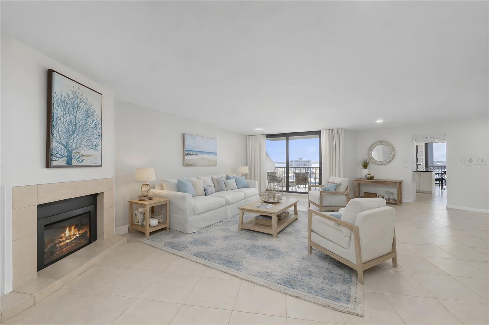 Virtually Staged - Living Room with electric fireplace and views of the water