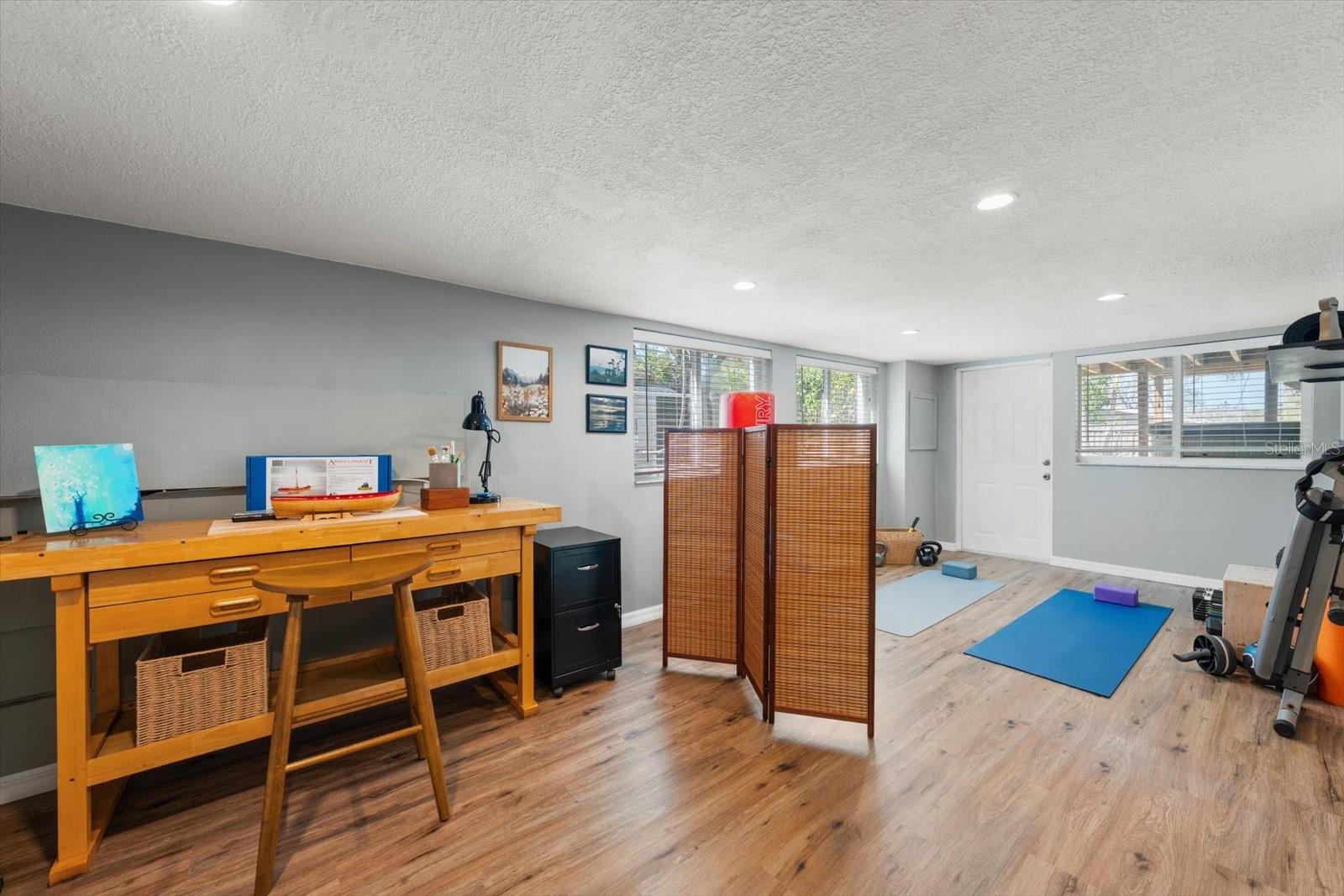 Lower level multi-purpose area is large and offers a variety of use.