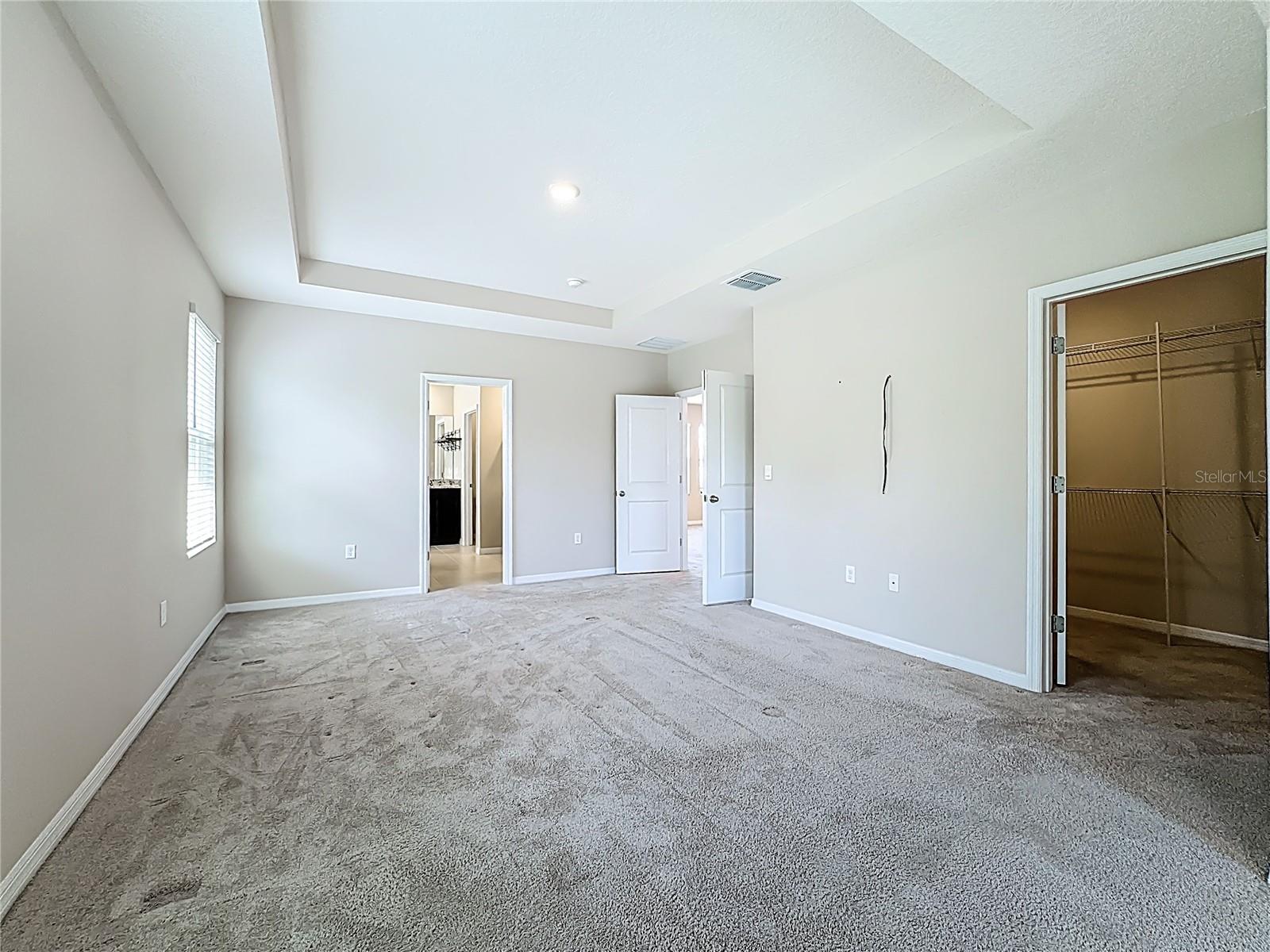 Primary Walk-In-Closet to right