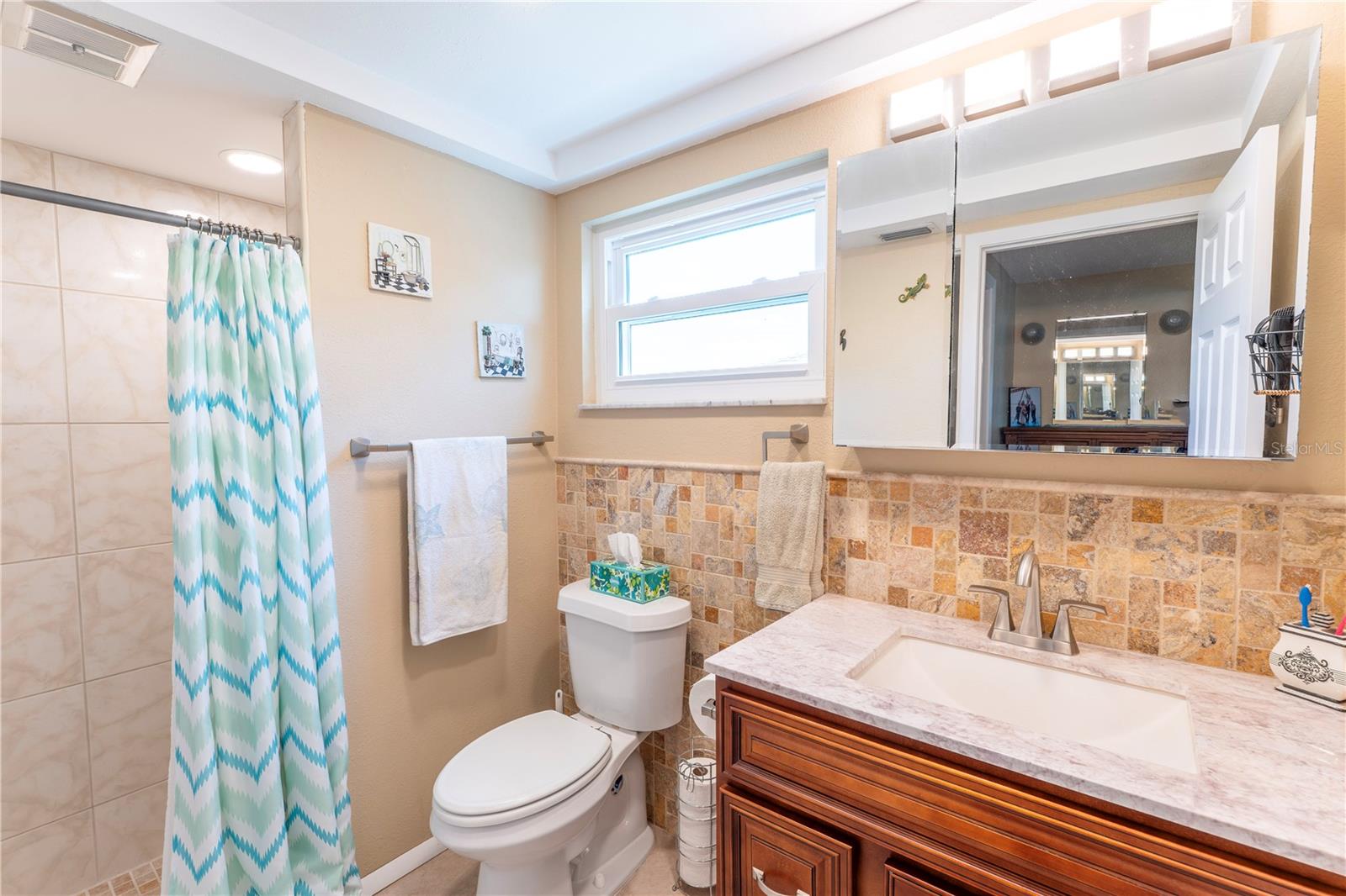 Tastefully updated bath with stylish finishes, a clean vanity, and a bright, refreshed feel.