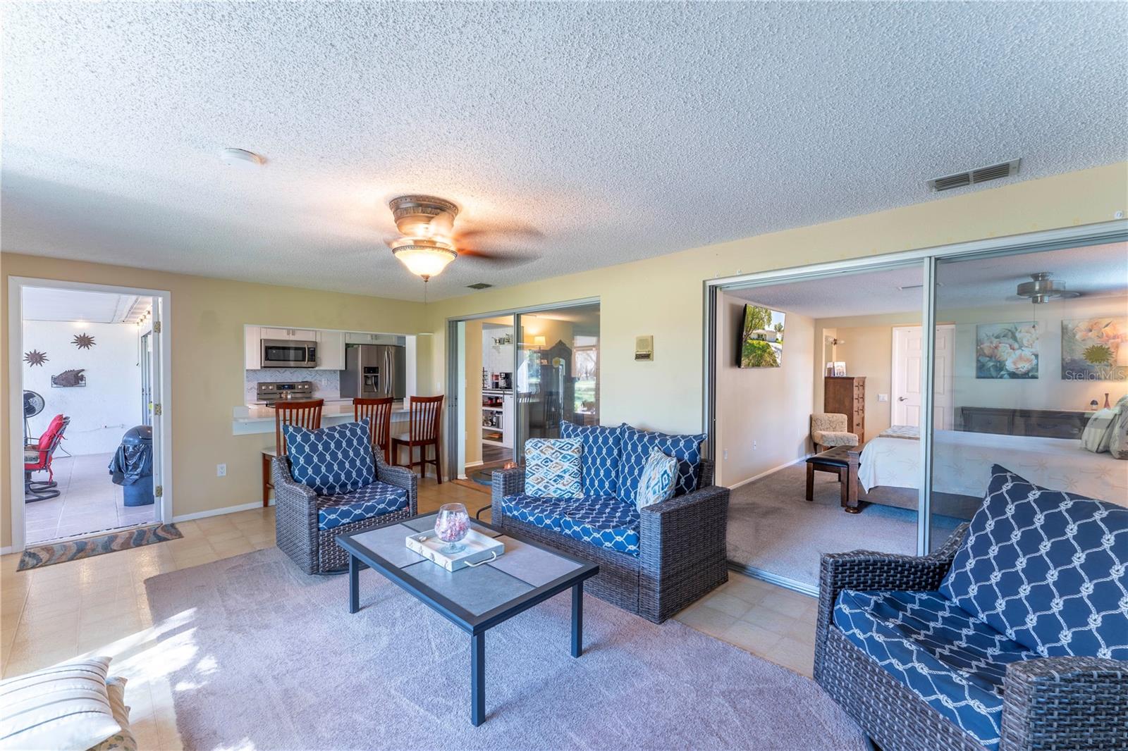 Great family room with seamless flow and abundant natural light throughout. A great place to enjoy the unobstructed view of the golf course. No rear neighbors!