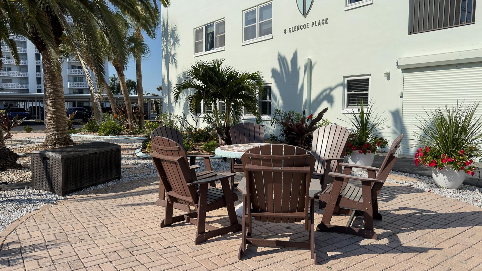 Beautifully landscaped grounds with mature trees and tropical plants