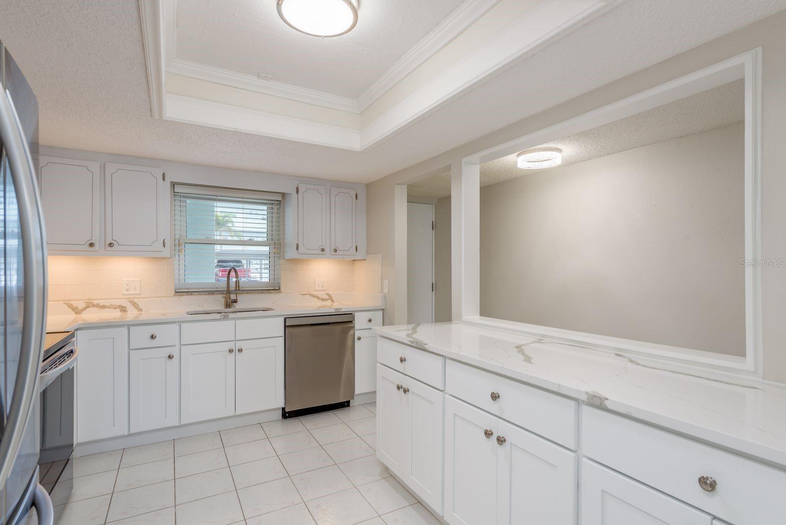 Beautifully updated kitchen with sleek countertops and quality appliances