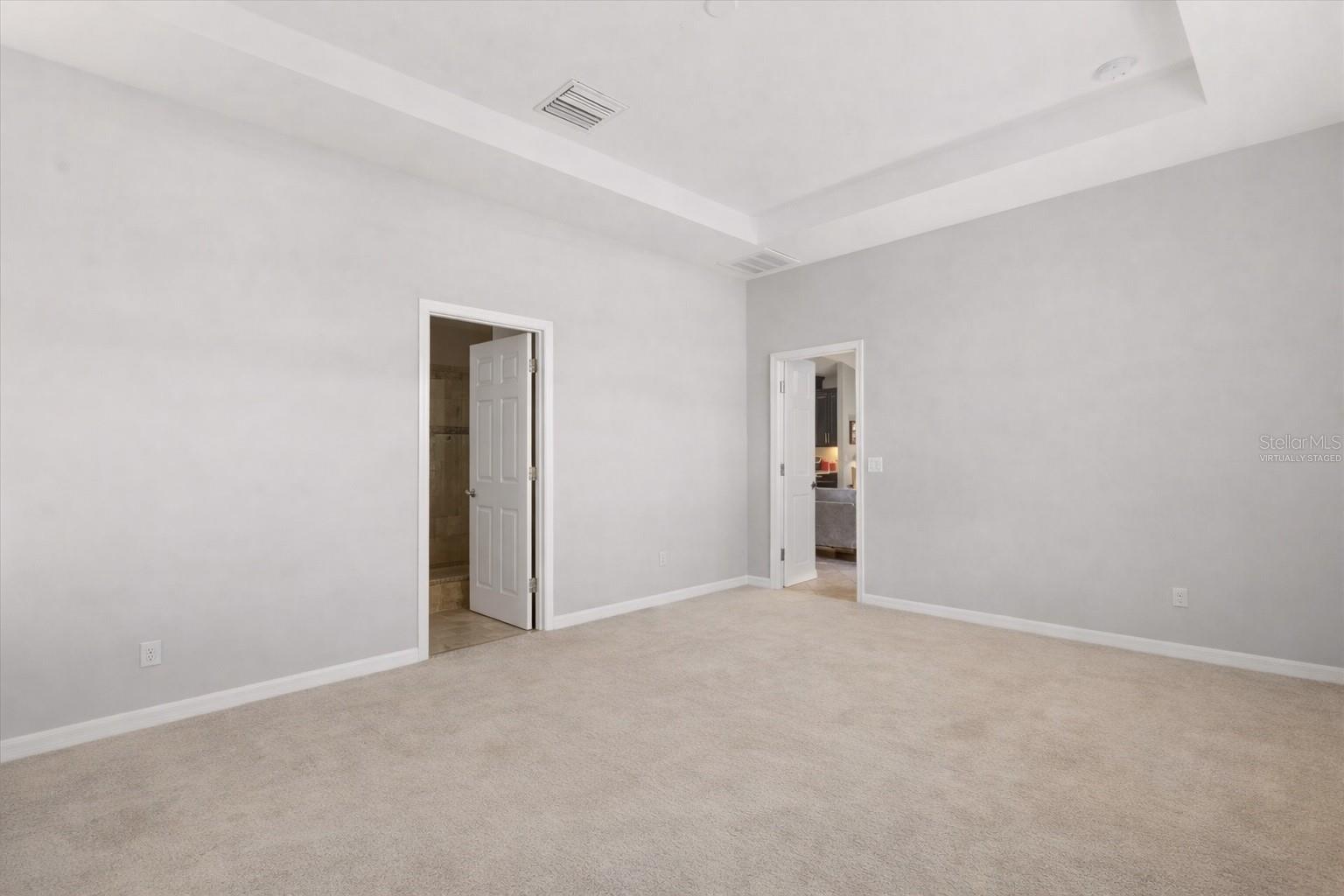 Empty primary bedroom -Virtually Staged