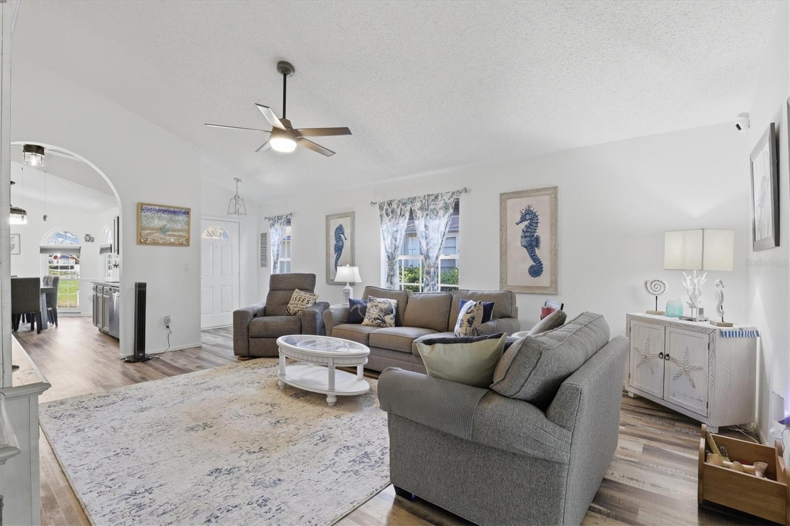 Living room just off the kitchen and front entry, creating a natural gathering space at the heart of the home.