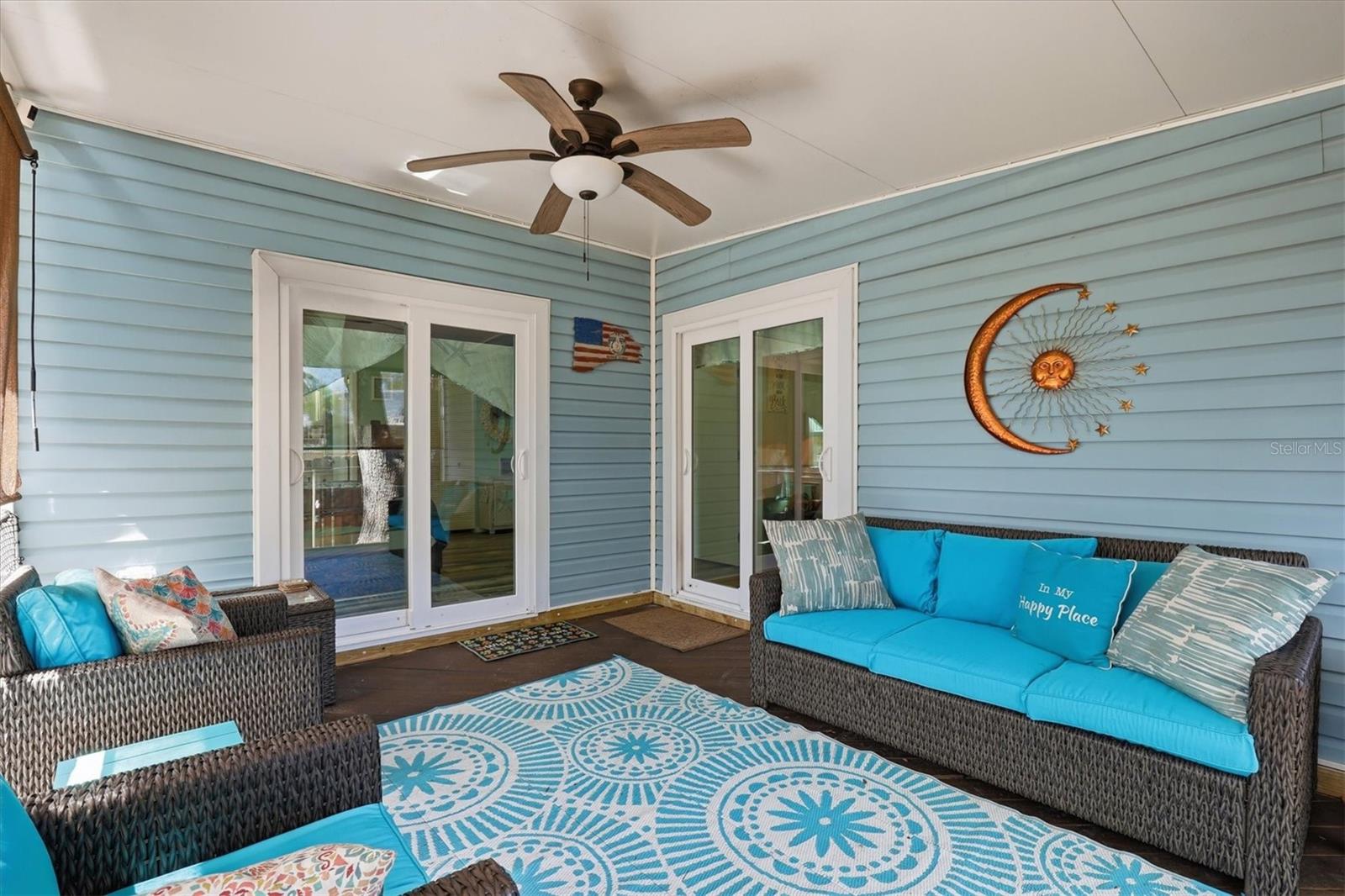 Spacious covered and screened porch, ideal for entertaining or relaxing while overlooking the backyard.