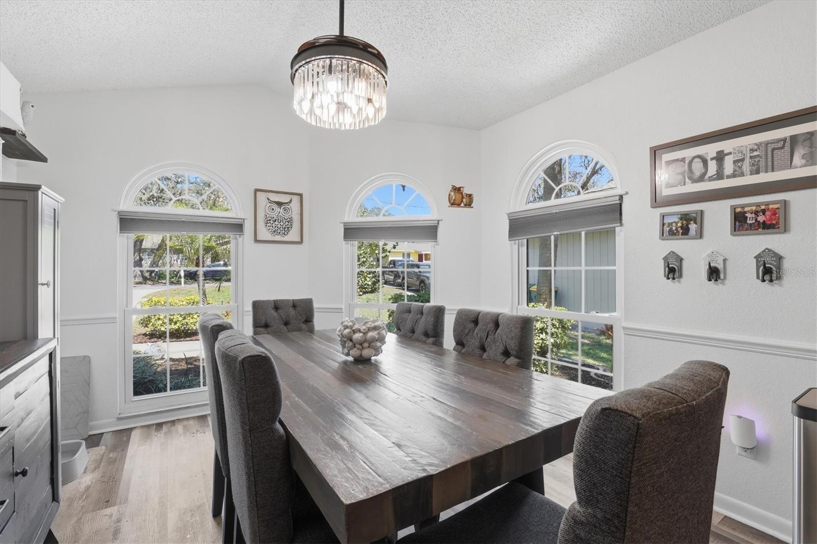 Bright dining area in the kitchen with a large window filling the space with natural light.