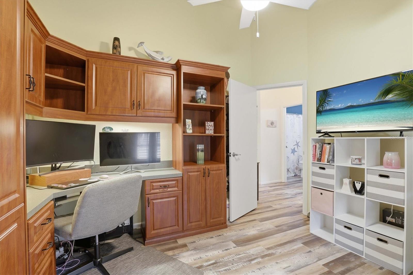 Third bedroom/office area with built-in Murphy bed, providing a flexible space for work, hobbies, or overnight guests.