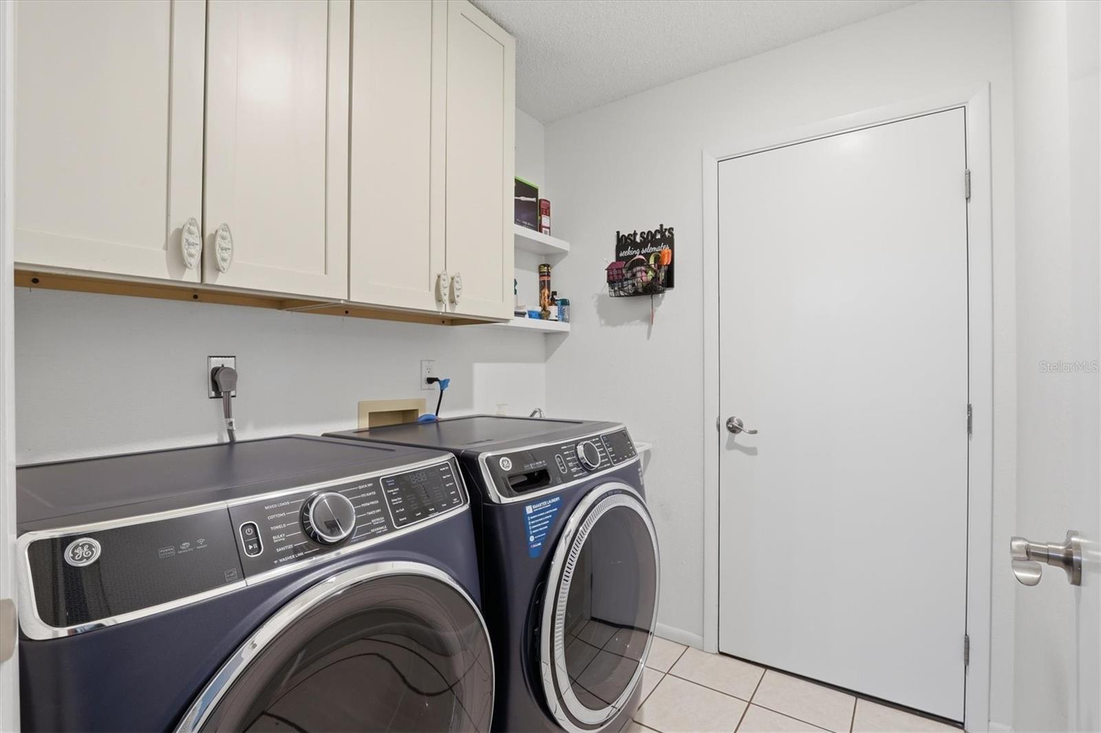 Inside laundry room with convenient access to the garage