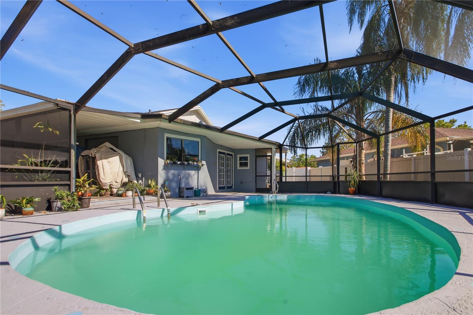 Large inground pool completely enclosed for your enjoyment.