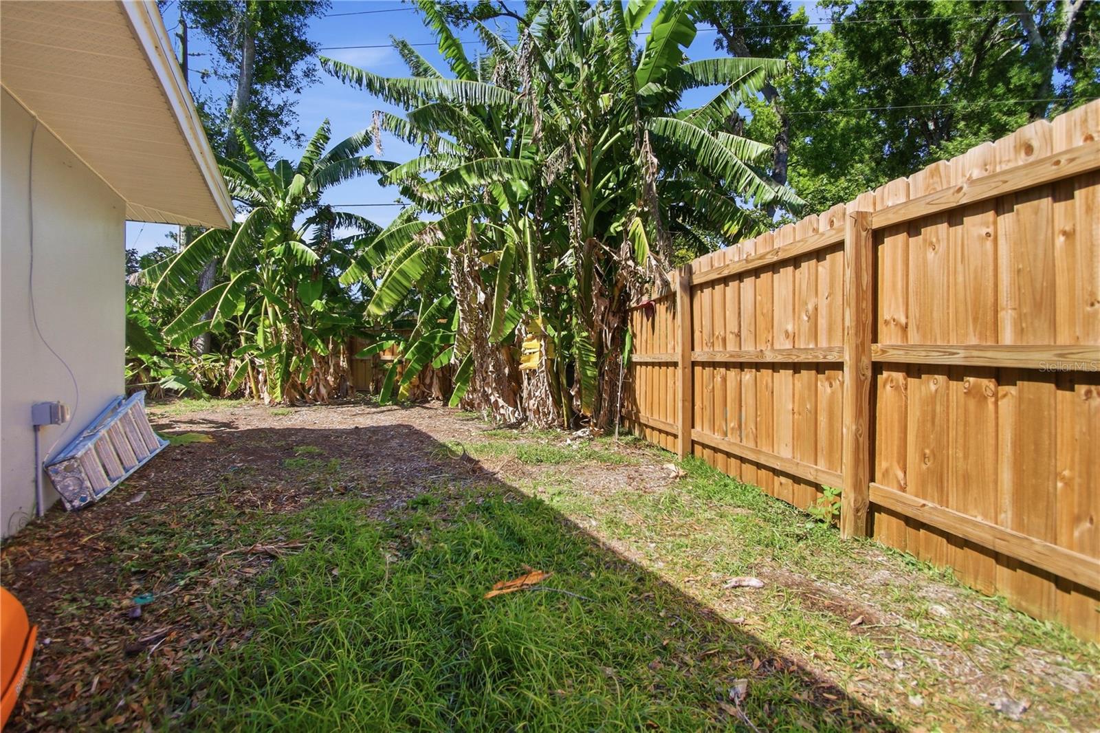 The front entrance to this are is on the right side of the home. You could fit a small boat or RV behind this fenced in area, but would probably need to get a larger fence door, if you wanted to do that.