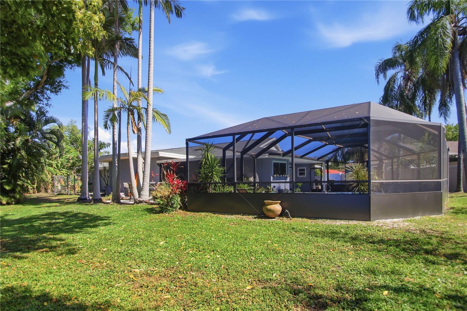 What makes this home complete is the beautiful screened enclosed inground pool