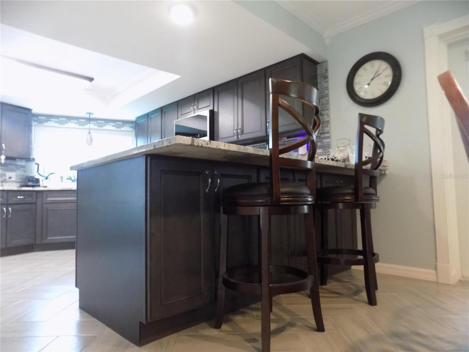 Seating at the counter for casual dining. But also note all the storage underneath!