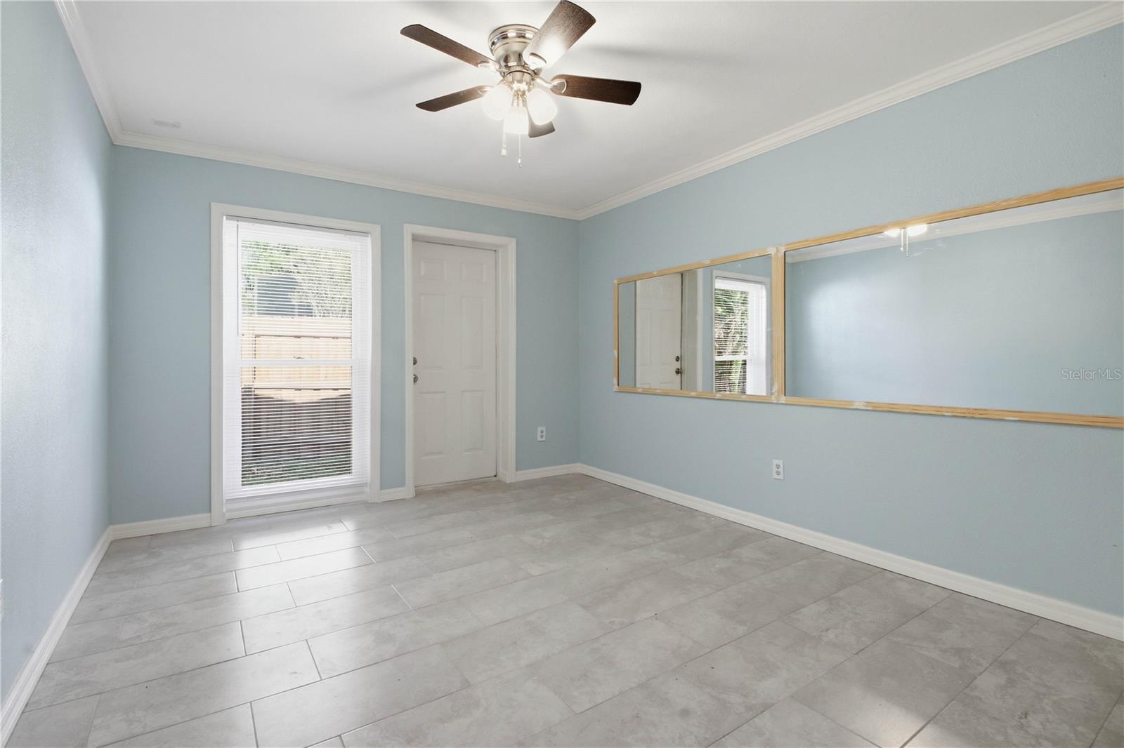 Further down the hall is the 2nd bedroom witch includes it's own outside entrance. A;so with plenty of natural light, this would make a great office if you didn't need it for a bedroom.