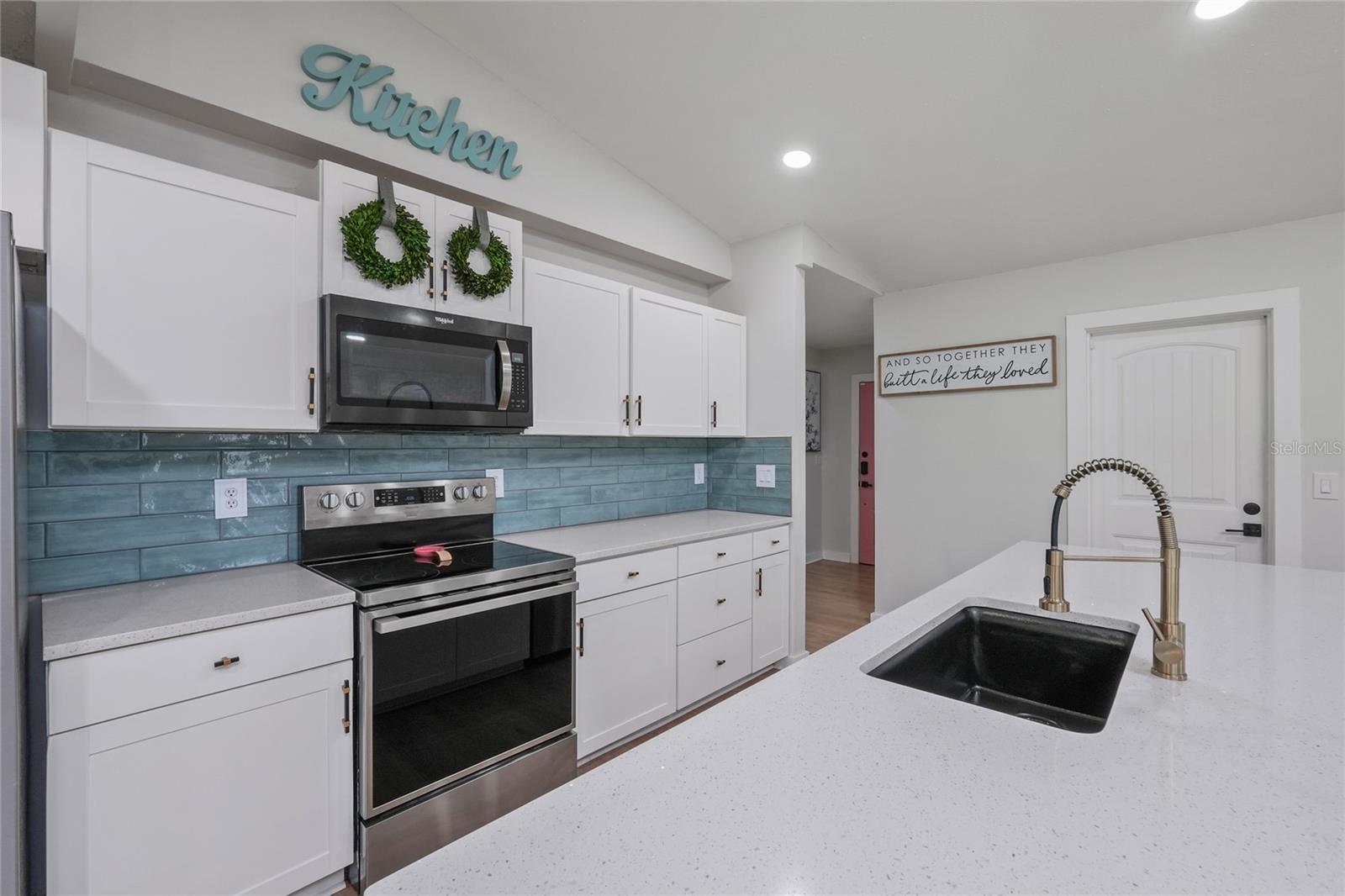 Quartz countertops, added cabinetry, and custom finishes throughout.