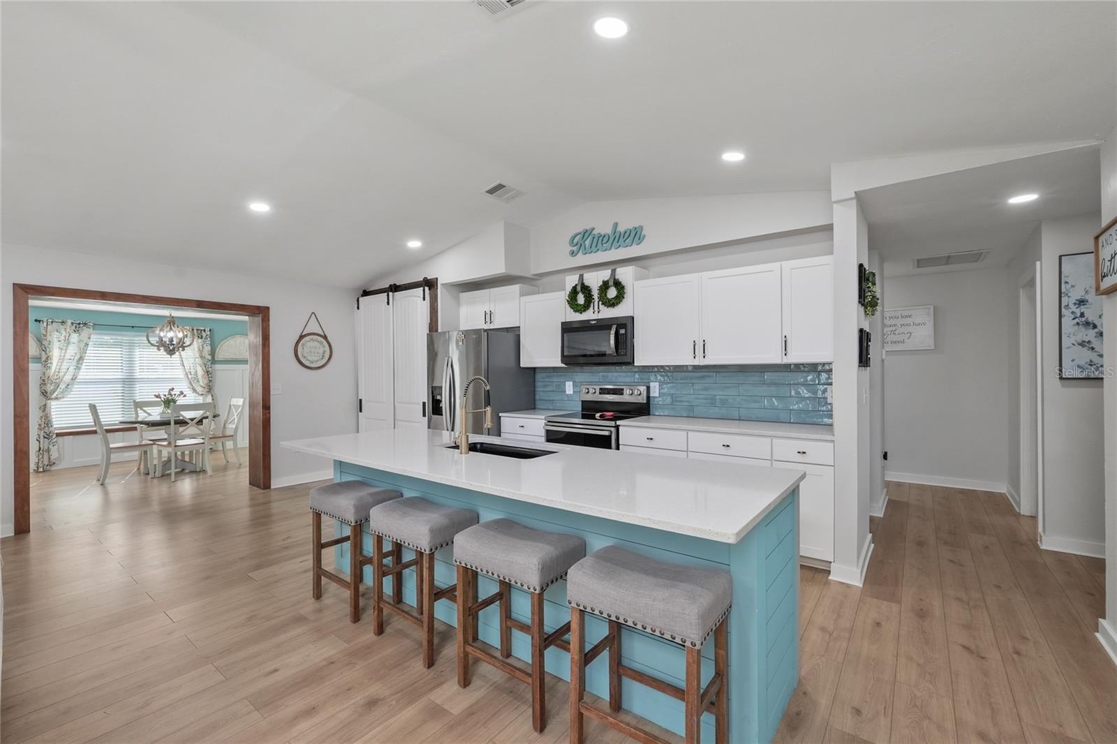 Shiplap-wrapped island and updated design details buyers are looking for.