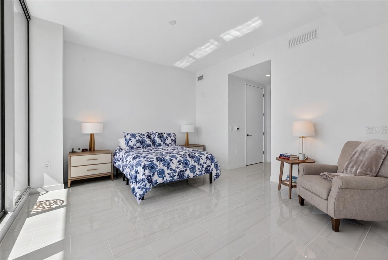 Primary Bedroom with Virtually Staged Chair