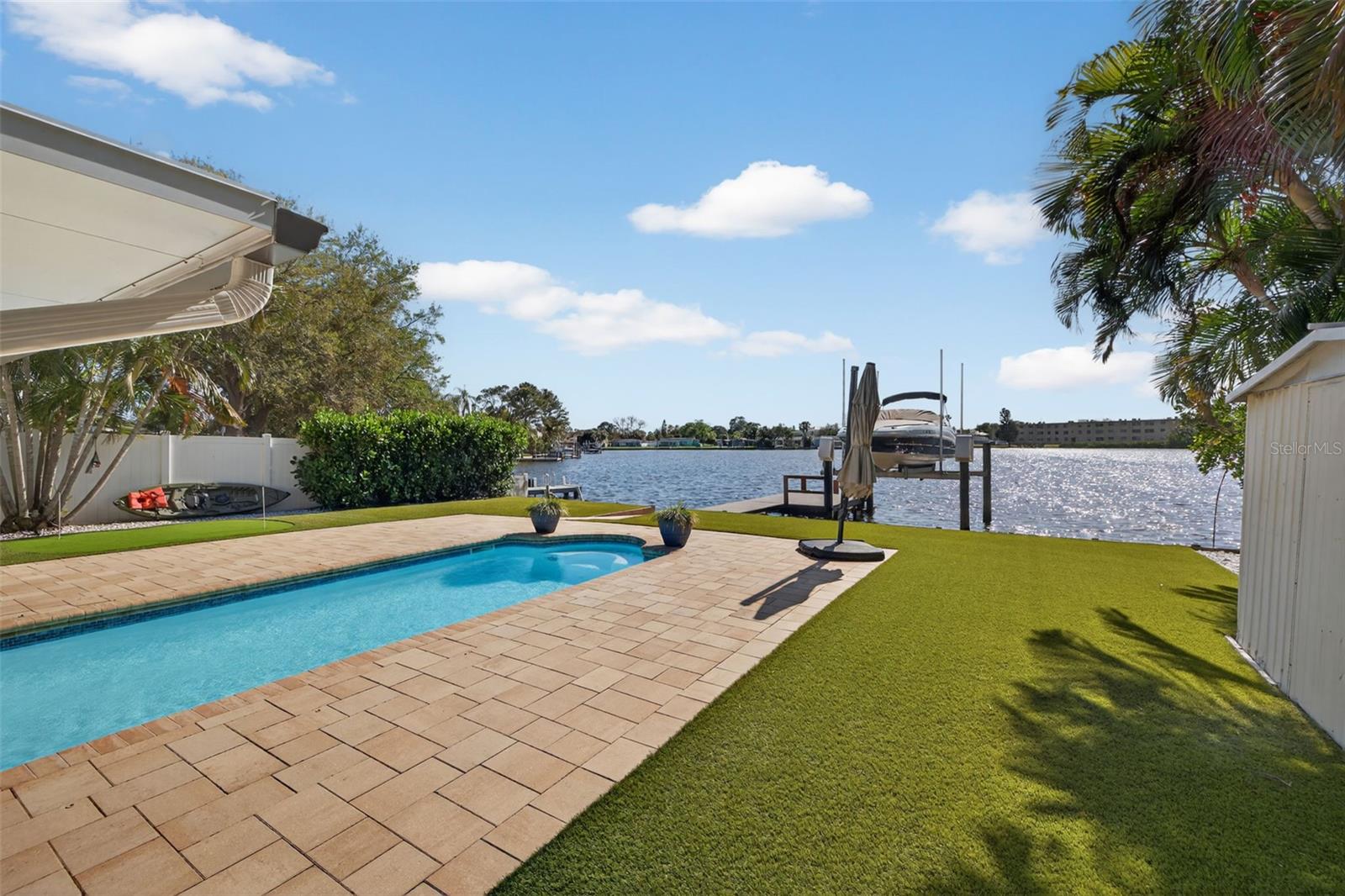 Crystal blue in ground pool, wide waterfront