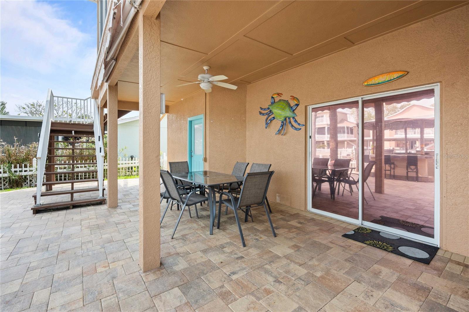 OUTDOOR PATIO W/PAVERS AND RETRACTABLE AWNINGNS