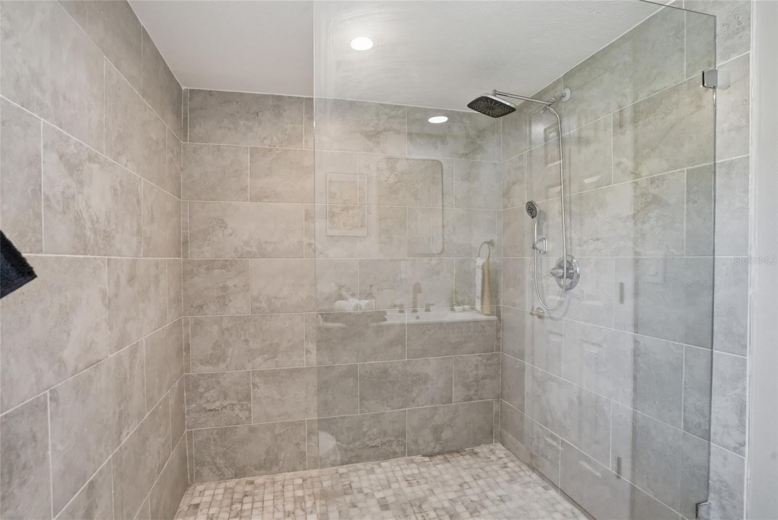 gigantic shower with frameless glass