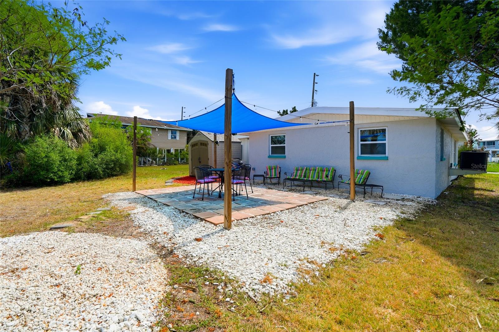 very spacious entertaining area is the heart of this home with beautiful Edison lighting at night