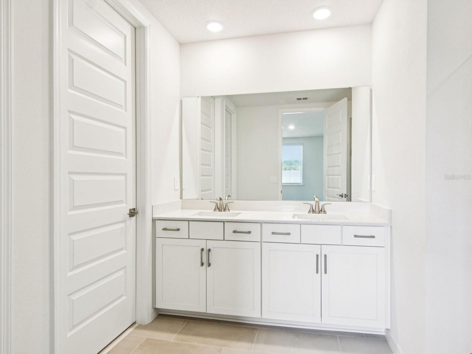 Interior photos are not of the actual home but are photos of the builder home with the same floorplan with similar interior finishes and features.