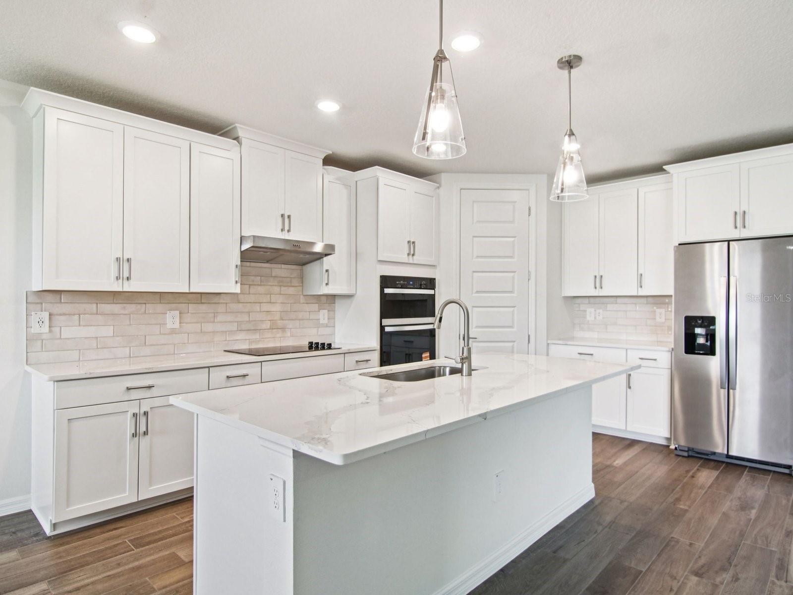 Interior photos are not of the actual home but are photos of the builder home with the same floorplan with similar interior finishes and features.