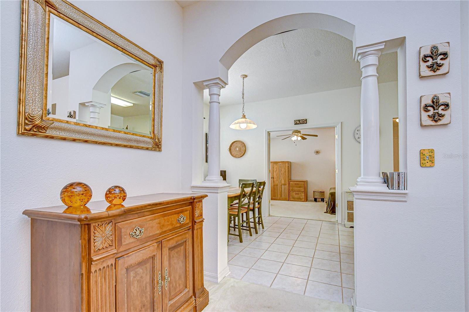 Beautiful architectural columns welcome you to the kitchen and dinette, and straight through takes you to the double-door den/office.