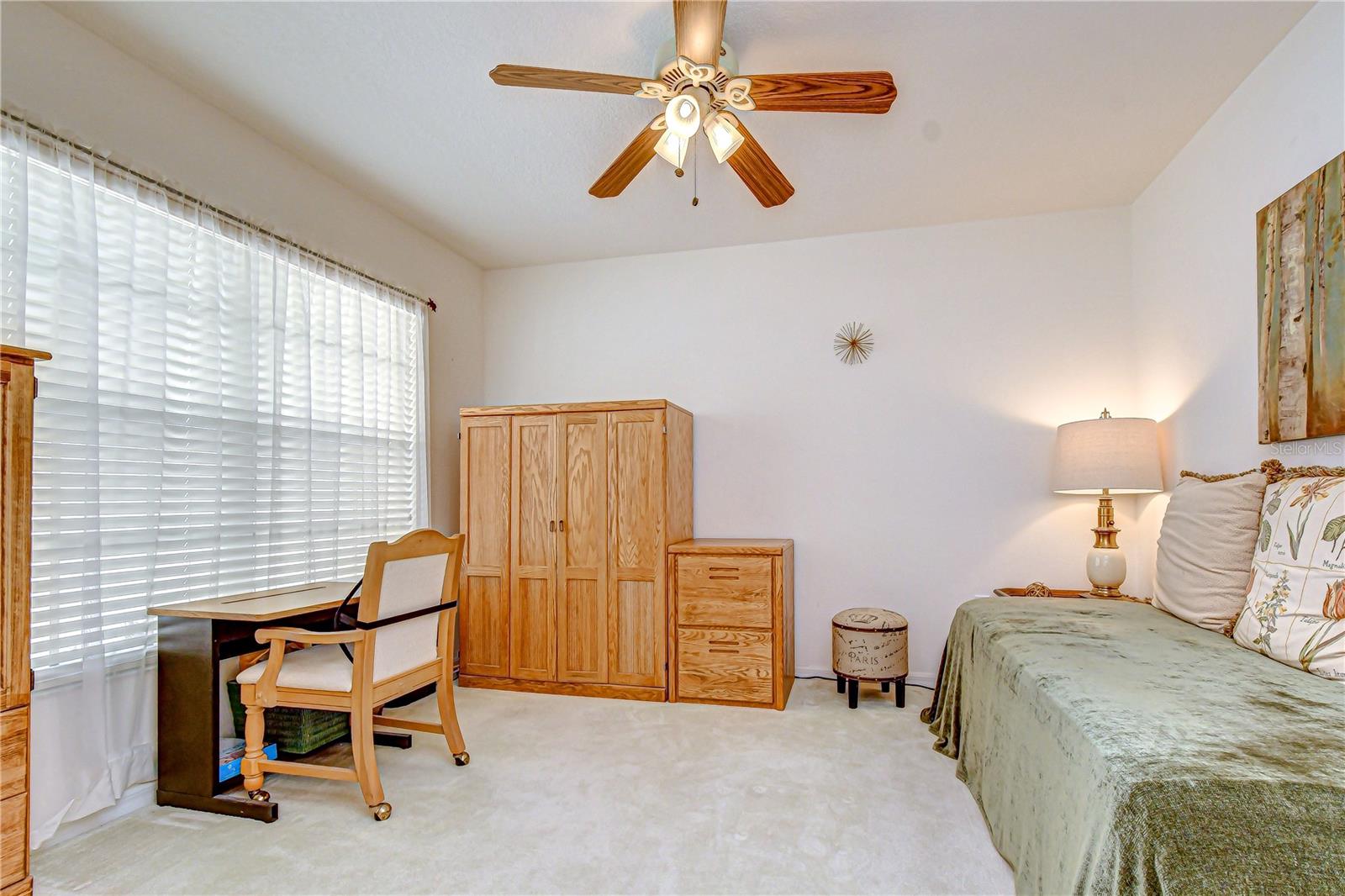 The large den/office area is bright and open with a large window.