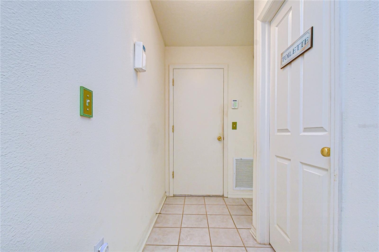 The 2nd bathroom is located just off the kitchen, and the hallway leads to the 2nd bedroom!